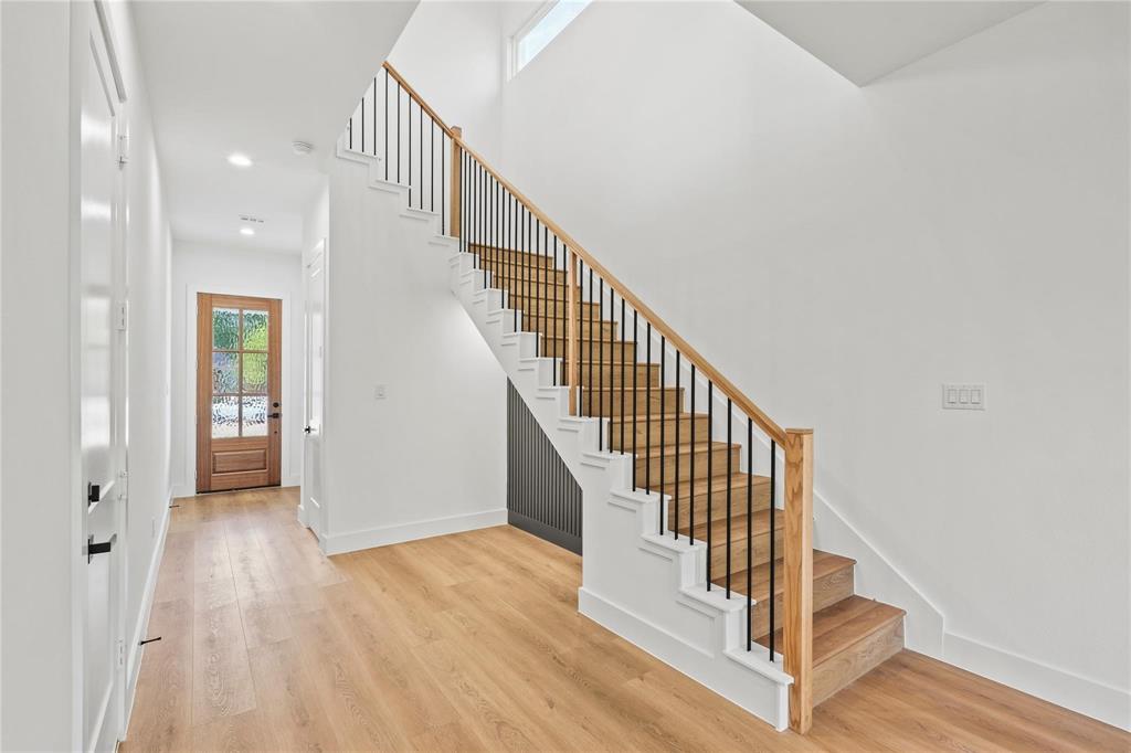 2820 Barnes Bridge Road Dallas, TX 75228 - Photo 3 of 29 a view of staircase with wooden floor and white walls