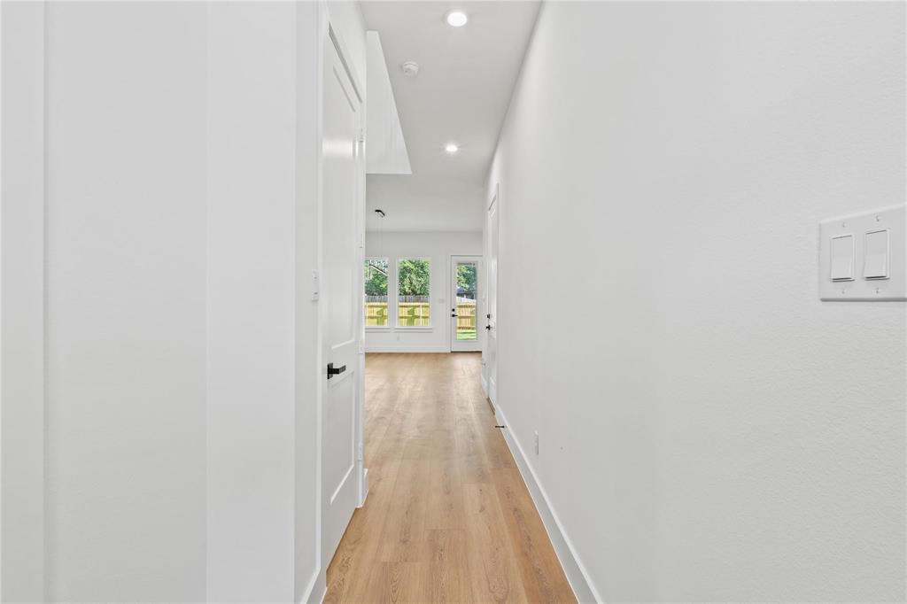 2820 Barnes Bridge Road Dallas, TX 75228 - Photo 5 of 29 a view of a hallway with wooden floor