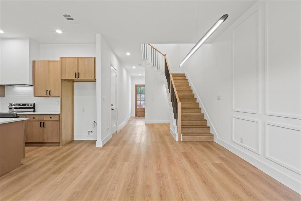 2820 Barnes Bridge Road Dallas, TX 75228 - Photo 7 of 29 a view of a kitchen with wooden floor and electronic appliances