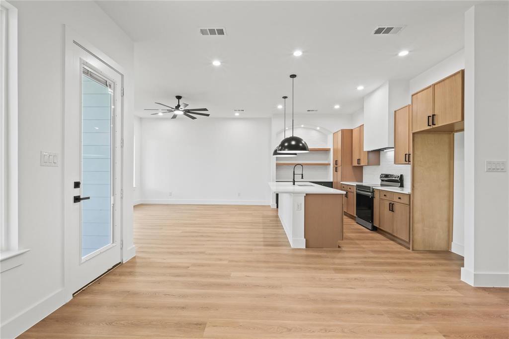 2820 Barnes Bridge Road Dallas, TX 75228 - Photo 10 of 29 a kitchen with stainless steel appliances a refrigerator and a stove top oven