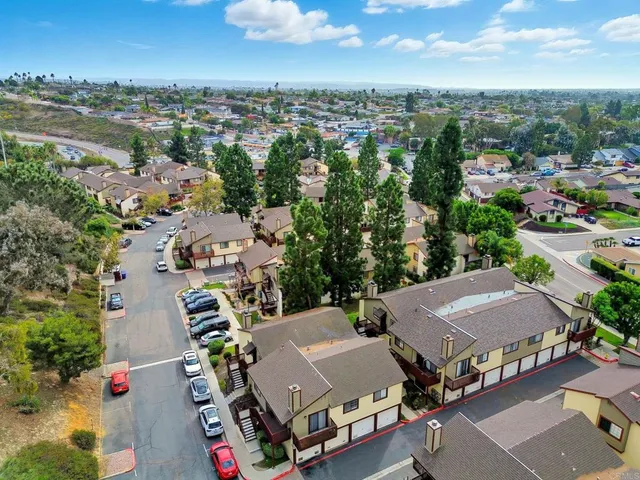 an aerial view of residential houses with outdoor space