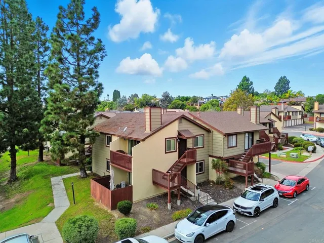 a aerial view of a house with swimming pool and garden