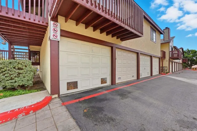 a pathway of a house with a yard