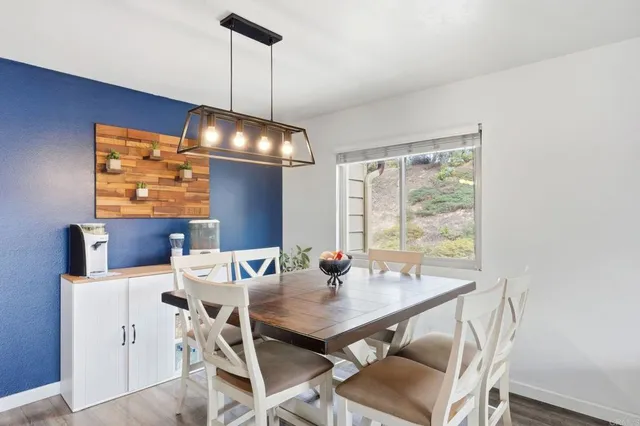 a view of a dining room with furniture window and outside view