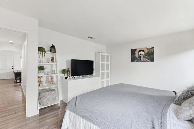 a hotel room with a television and a bed