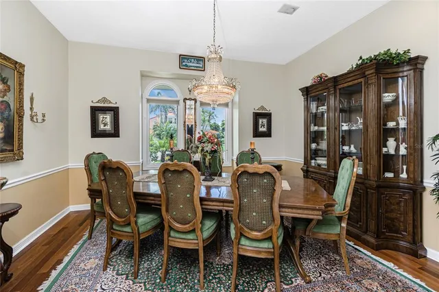 a kitchen with stainless steel appliances granite countertop a refrigerator a stove and a sink