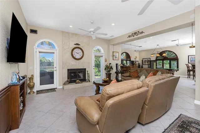 a kitchen with stainless steel appliances granite countertop a sink a stove and a wooden cabinets