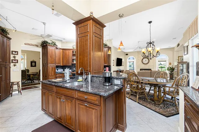 a large bathroom with a granite countertop sink a mirror and a bathtub