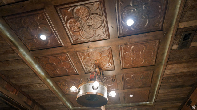 2983 East Ridgetop Road, Unit 27 Provo, UT 84604 - Photo 17 of 63 Coffered ceiling with decorative carved wood panels and integrated pendant lighting fixture featuring multiple light sources and brushed metal accents
