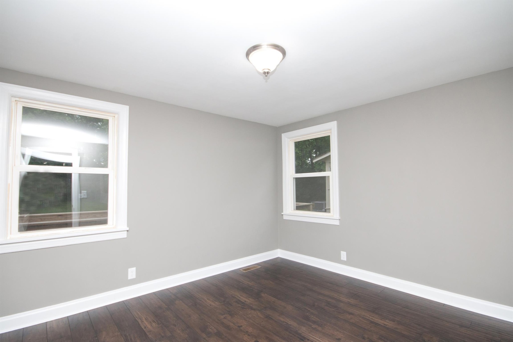 212 Neelys Bend Road Madison, TN 37115 - Photo 11 of 14 a view of an empty room with wooden floor and a window