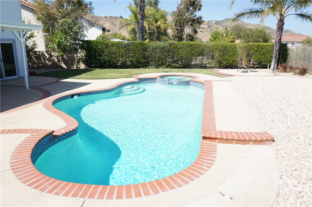 19584 Shadow Glen Circle Porter Ranch, CA 91326 - Photo 45 of 72 a view of a swimming pool with an outdoor space