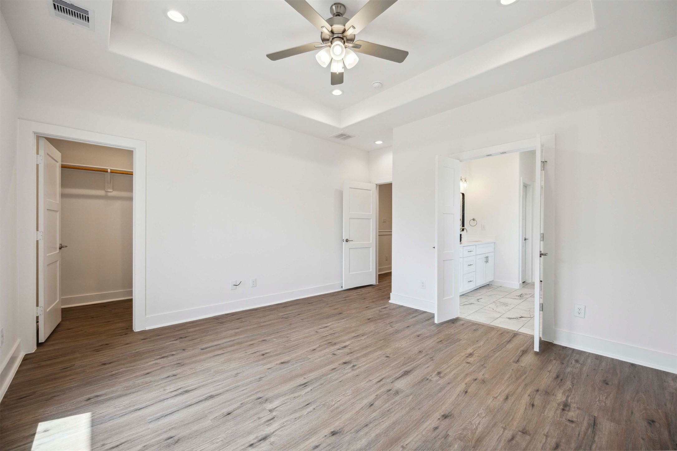 3504 Caplin Street, Unit B Houston, TX 77026 - Photo 14 of 26 wooden floor in an empty room with a window