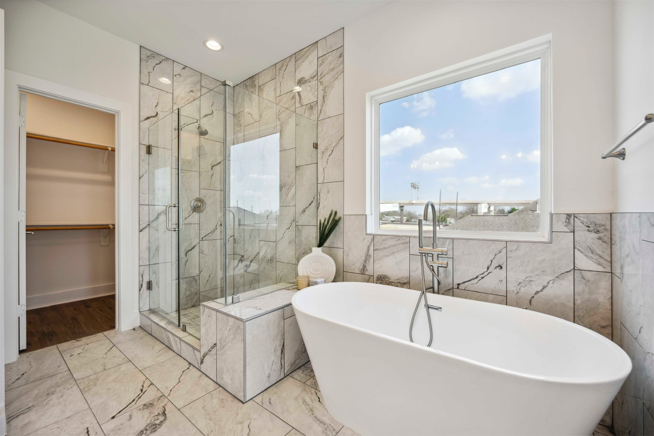 3504 Caplin Street, Unit B Houston, TX 77026 - Photo 16 of 26 a bathroom with a bathtub and a shower