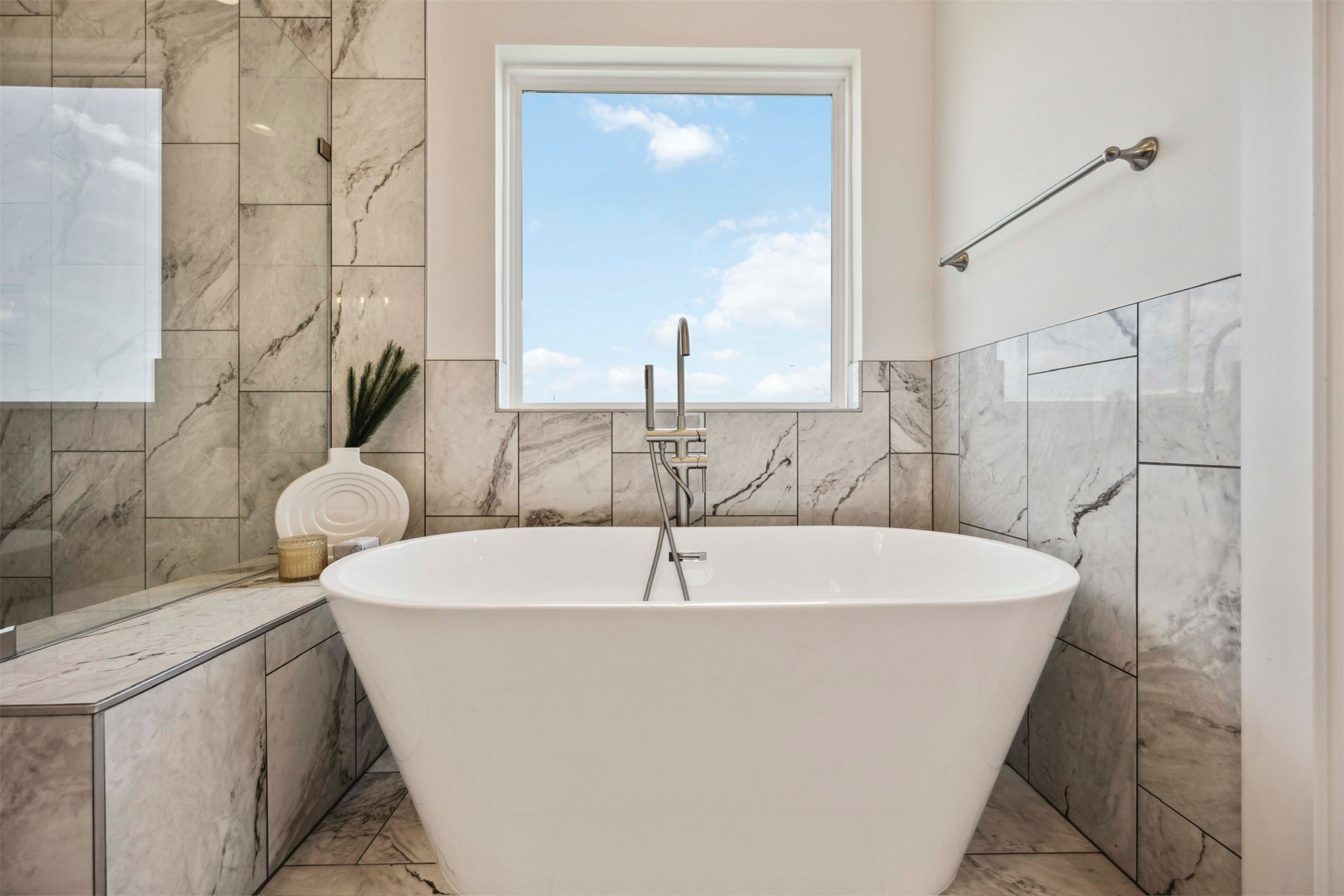 3504 Caplin Street, Unit B Houston, TX 77026 - Photo 17 of 26 a white bath tub sitting in a bathroom