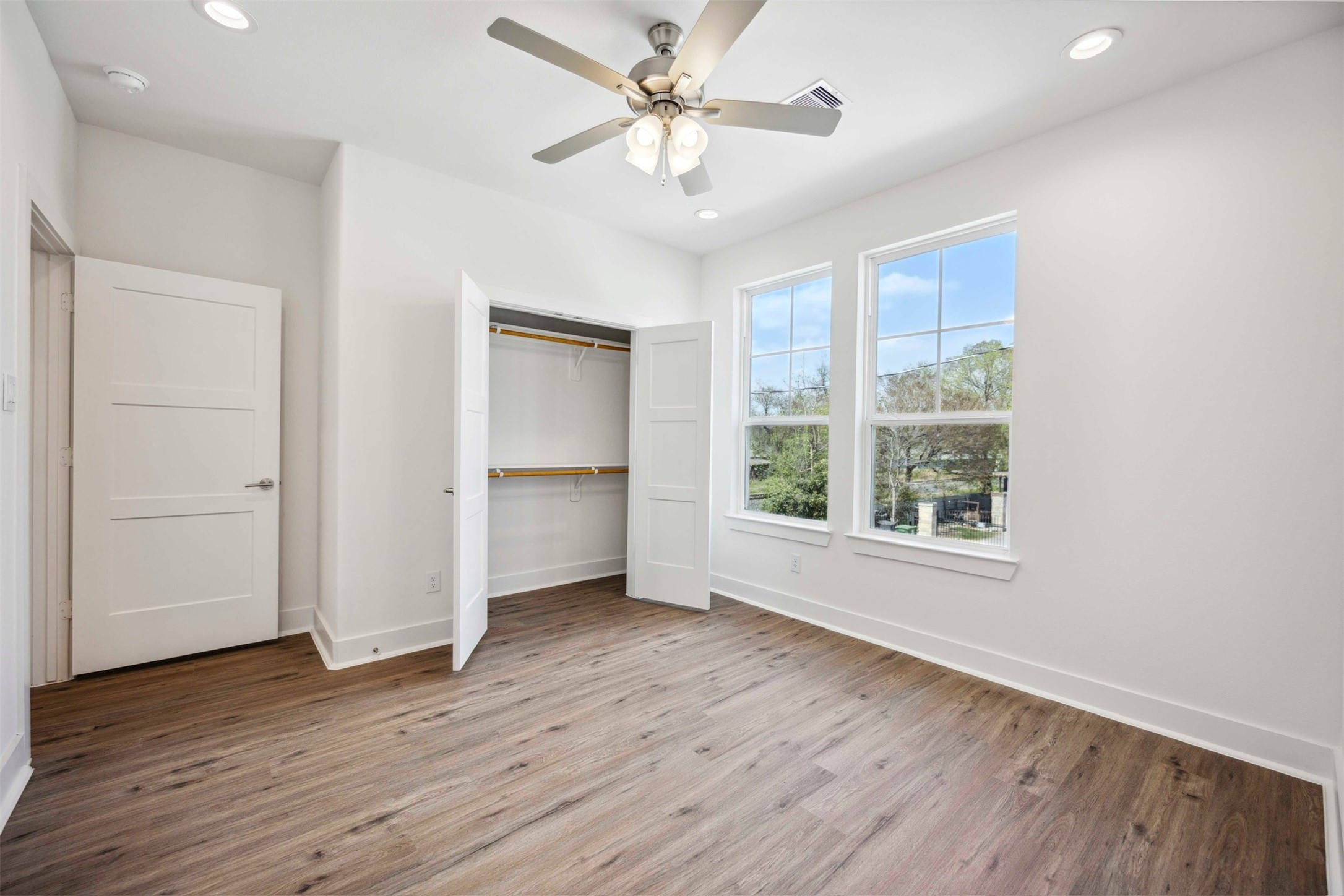 3504 Caplin Street, Unit B Houston, TX 77026 - Photo 21 of 26 wooden floor in an empty room with a window