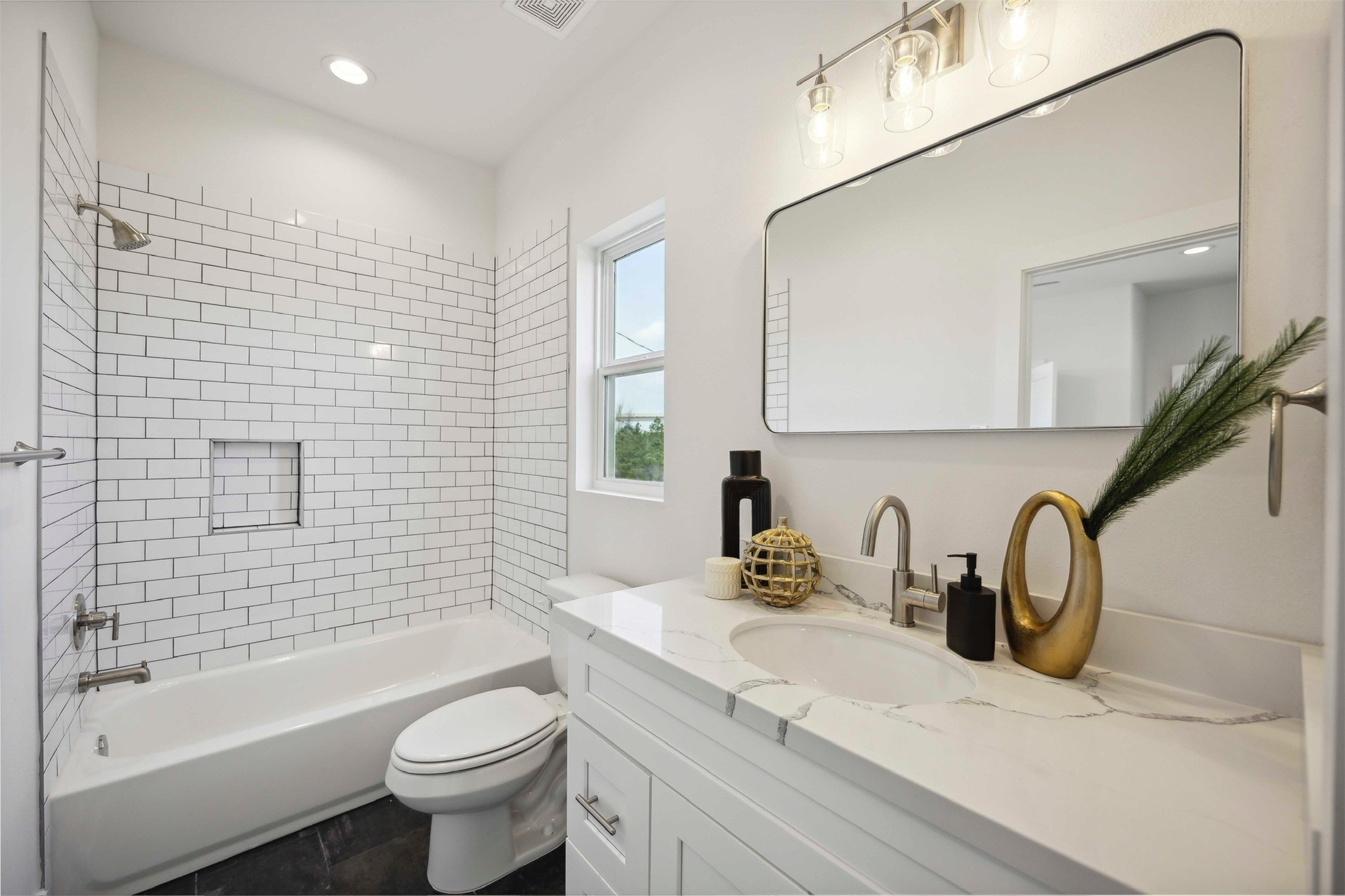 3504 Caplin Street, Unit B Houston, TX 77026 - Photo 22 of 26 a bathroom with a sink mirror toilet and bathtub