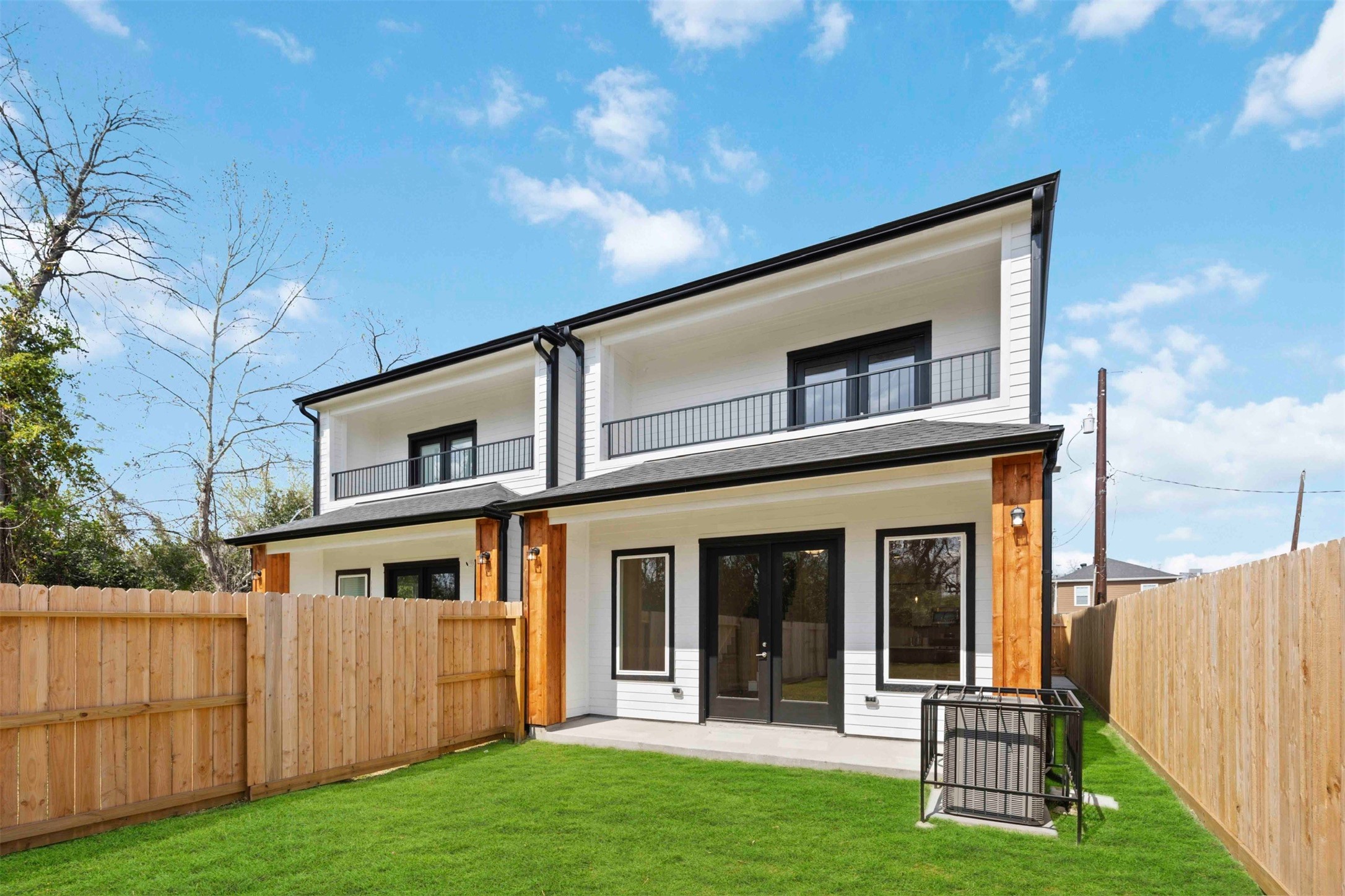 3504 Caplin Street, Unit B Houston, TX 77026 - Photo 24 of 26 a front view of a house with a yard