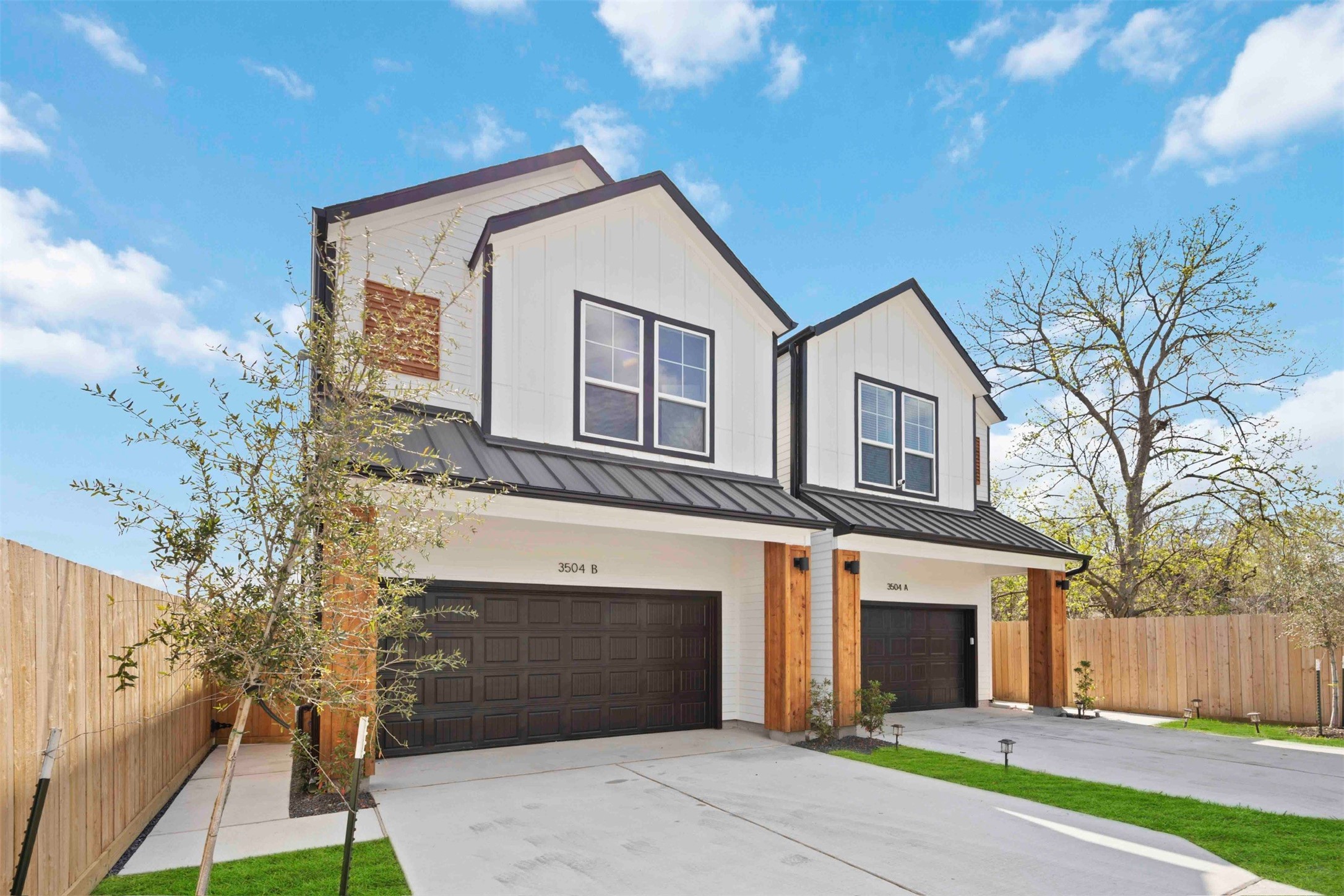 3504 Caplin Street, Unit B Houston, TX 77026 - Photo 26 of 26 a front view of a house with a yard and garage