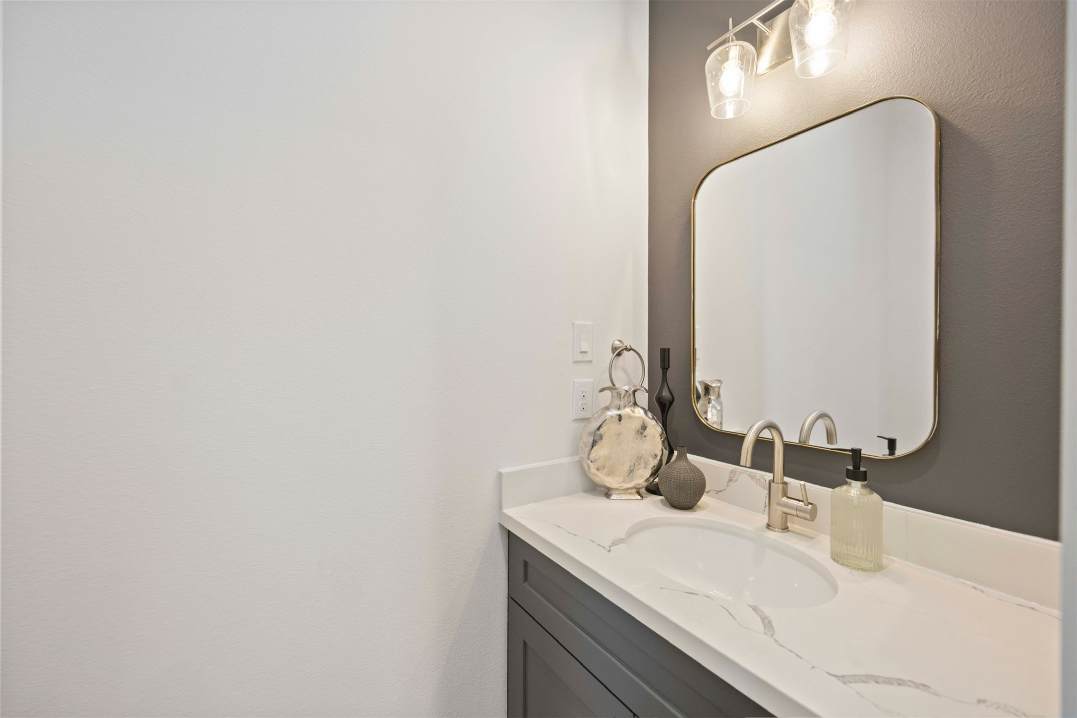 3504 Caplin Street, Unit B Houston, TX 77026 - Photo 9 of 26 a bathroom with a sink and a mirror