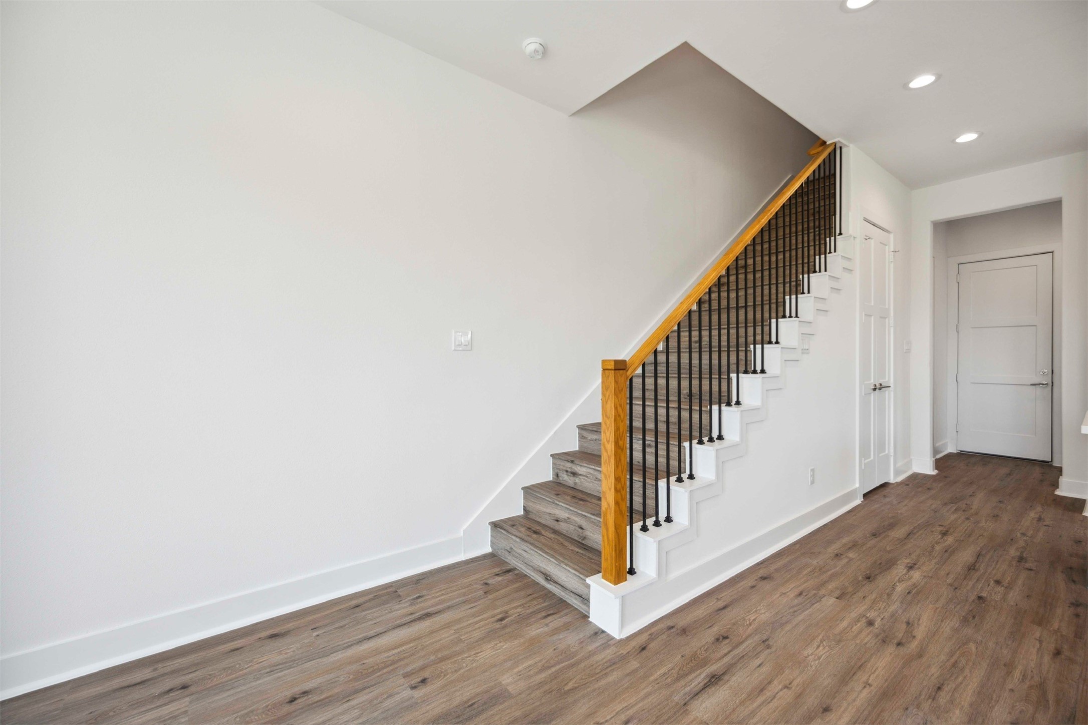 3504 Caplin Street, Unit B Houston, TX 77026 - Photo 10 of 26 a view of a hallway with wooden floor and entryway