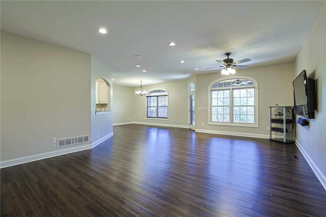 3681 Wilmington Road Lebanon, OH 45036 - Photo 3 of 87 This airy living space features lustrous wood flooring and arched windows, offering abundant natural light.
