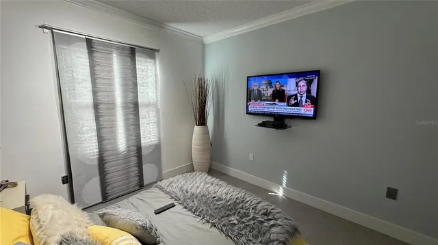 a bedroom with a bed and furniture