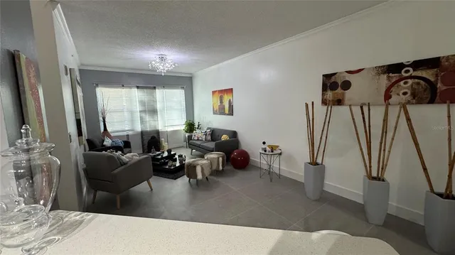 a kitchen with stainless steel appliances a stove a sink and a refrigerator