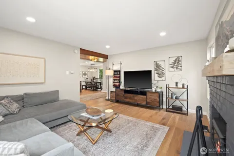 a living room with fireplace furniture and a flat screen tv