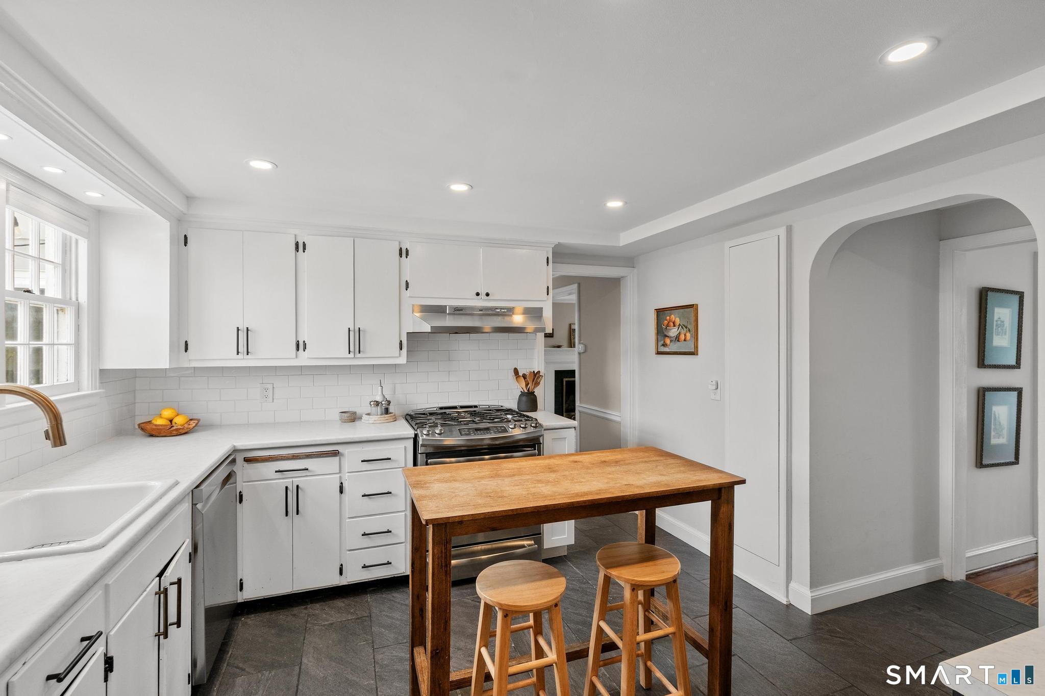 40 Fairlee Road West Hartford, CT 06107 - Photo 13 of 40 Updated kitchen with tile flooring, white cabinetry, recessed lighting, and center island.