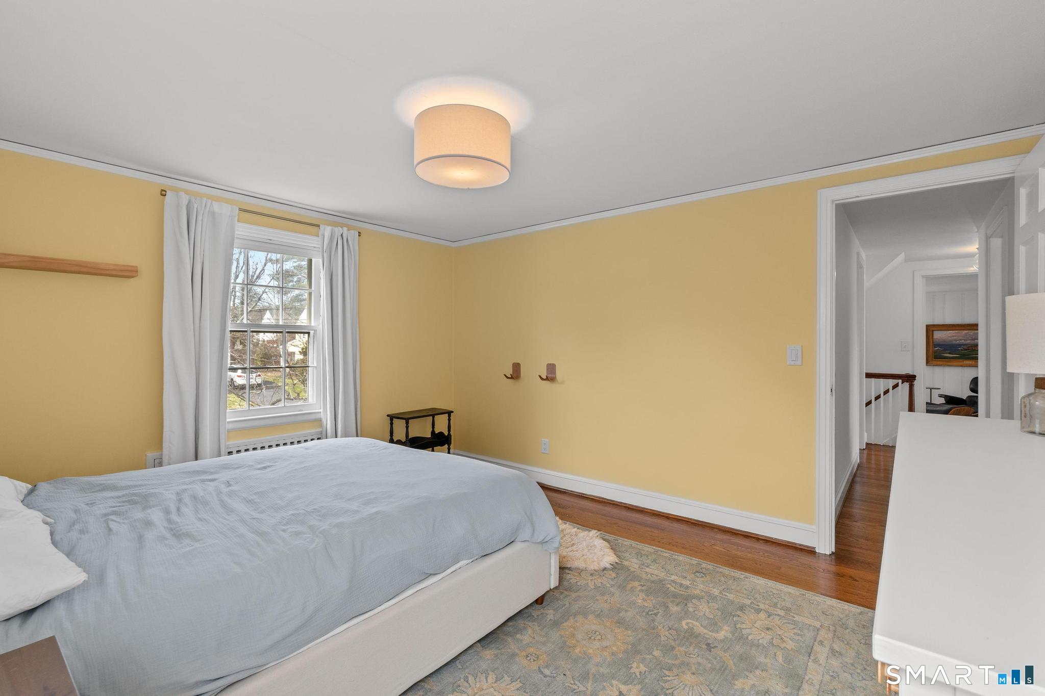 40 Fairlee Road West Hartford, CT 06107 - Photo 22 of 40 Spacious bedroom with hardwood floors and natural light.