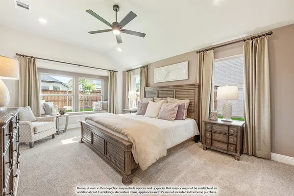 a bedroom with a large bed and a large window
