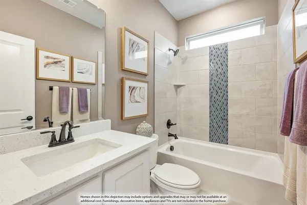 a bathroom with a granite countertop sink a toilet and bathtub