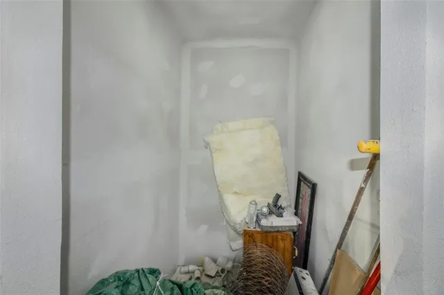 a bathroom with a sink a toilet and a shower curtain