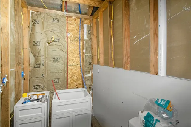 a bedroom with a bed and a television in it