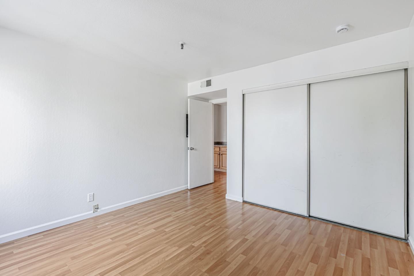 49 Showers Drive, Unit W203 Mountain View, CA 94040 - Photo 13 of 38 a view of an empty room with wooden floor