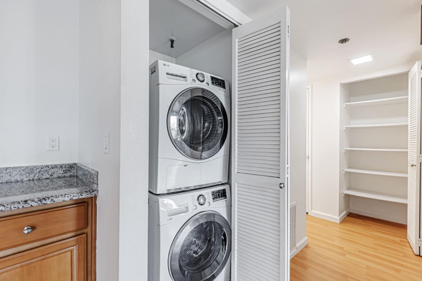49 Showers Drive, Unit W203 Mountain View, CA 94040 - Photo 16 of 38 a view of a kitchen with washer and dryer