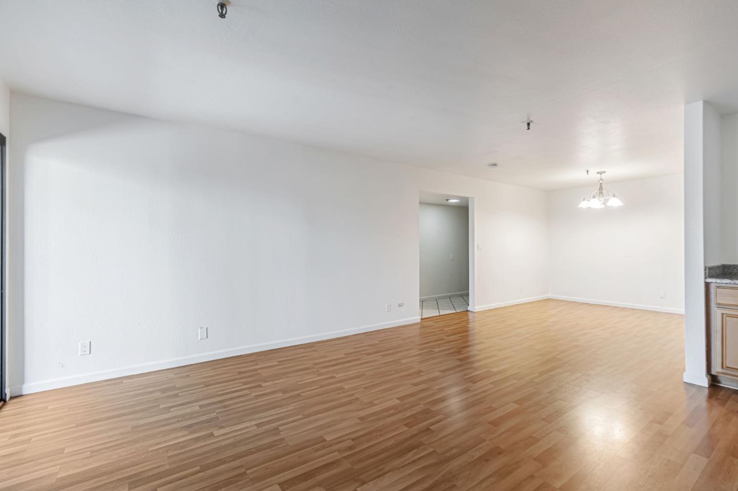 49 Showers Drive, Unit W203 Mountain View, CA 94040 - Photo 18 of 38 a view of empty room with wooden floor