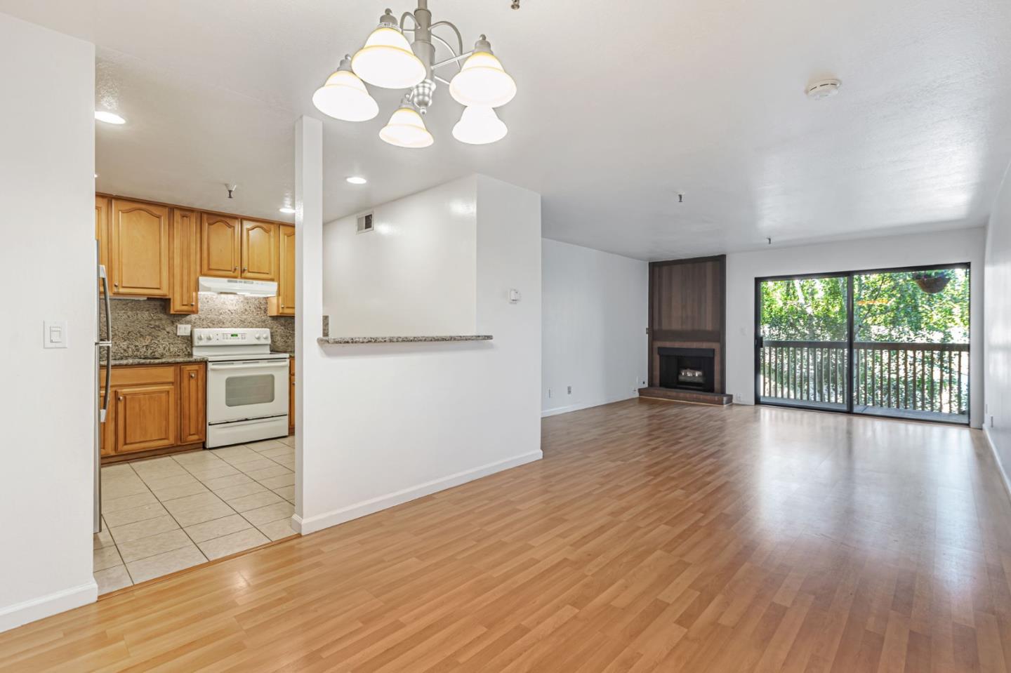 49 Showers Drive, Unit W203 Mountain View, CA 94040 - Photo 19 of 38 a view of a kitchen with wooden floor and a kitchen