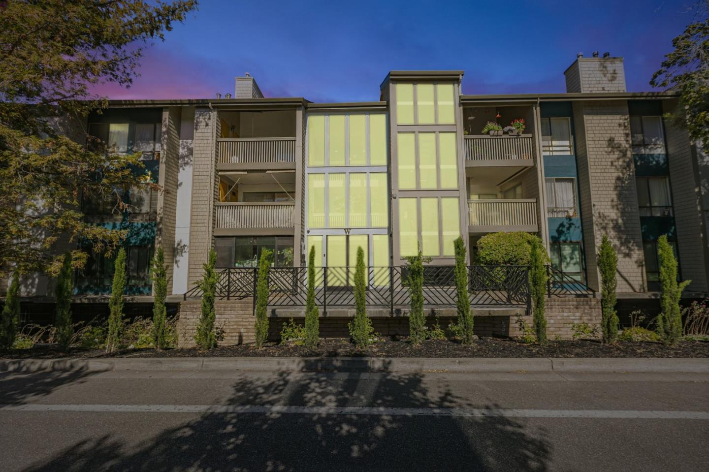 49 Showers Drive, Unit W203 Mountain View, CA 94040 - Photo 2 of 38 a front view of a building with a garden