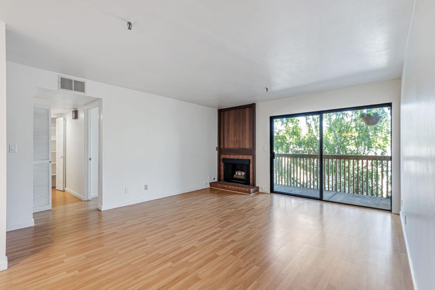 49 Showers Drive, Unit W203 Mountain View, CA 94040 - Photo 23 of 38 a view of an empty room with wooden floor and a window