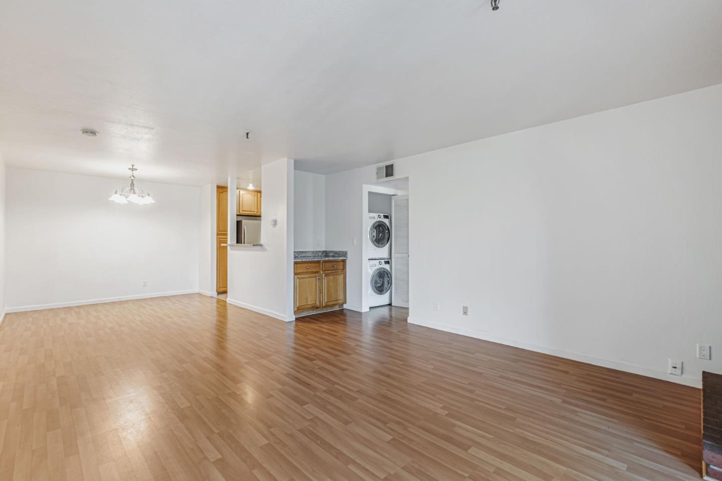 49 Showers Drive, Unit W203 Mountain View, CA 94040 - Photo 26 of 38 a view of empty room with wooden floor