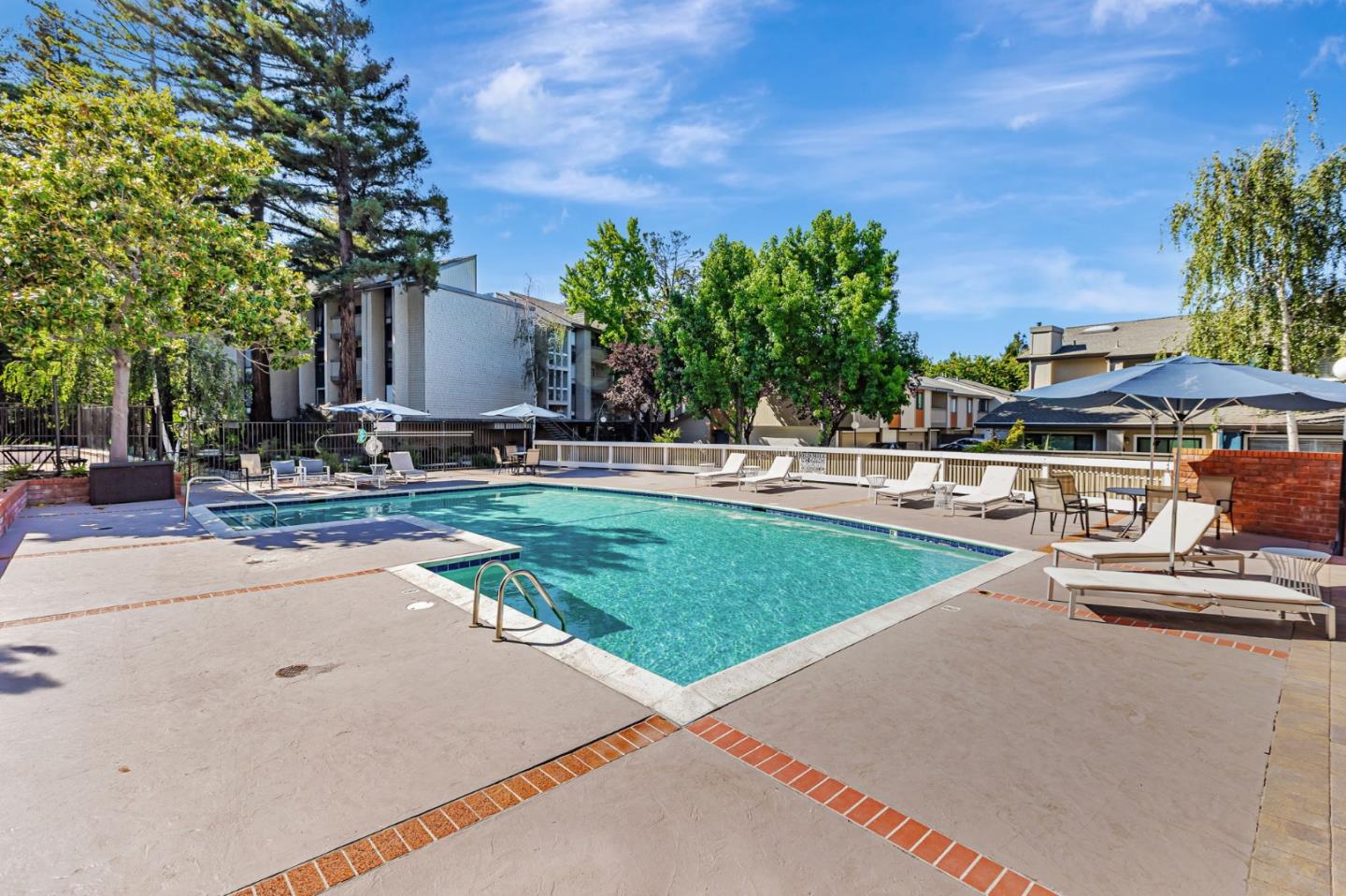 49 Showers Drive, Unit W203 Mountain View, CA 94040 - Photo 32 of 38 a view of a backyard with plants and palm tree