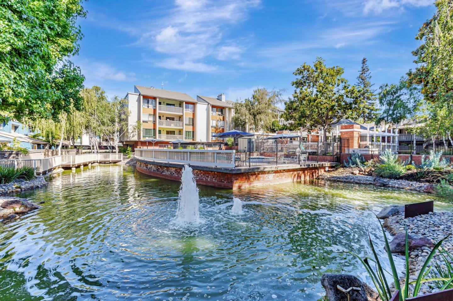 49 Showers Drive, Unit W203 Mountain View, CA 94040 - Photo 33 of 38 a view of swimming pool with outdoor seating and trees in the background