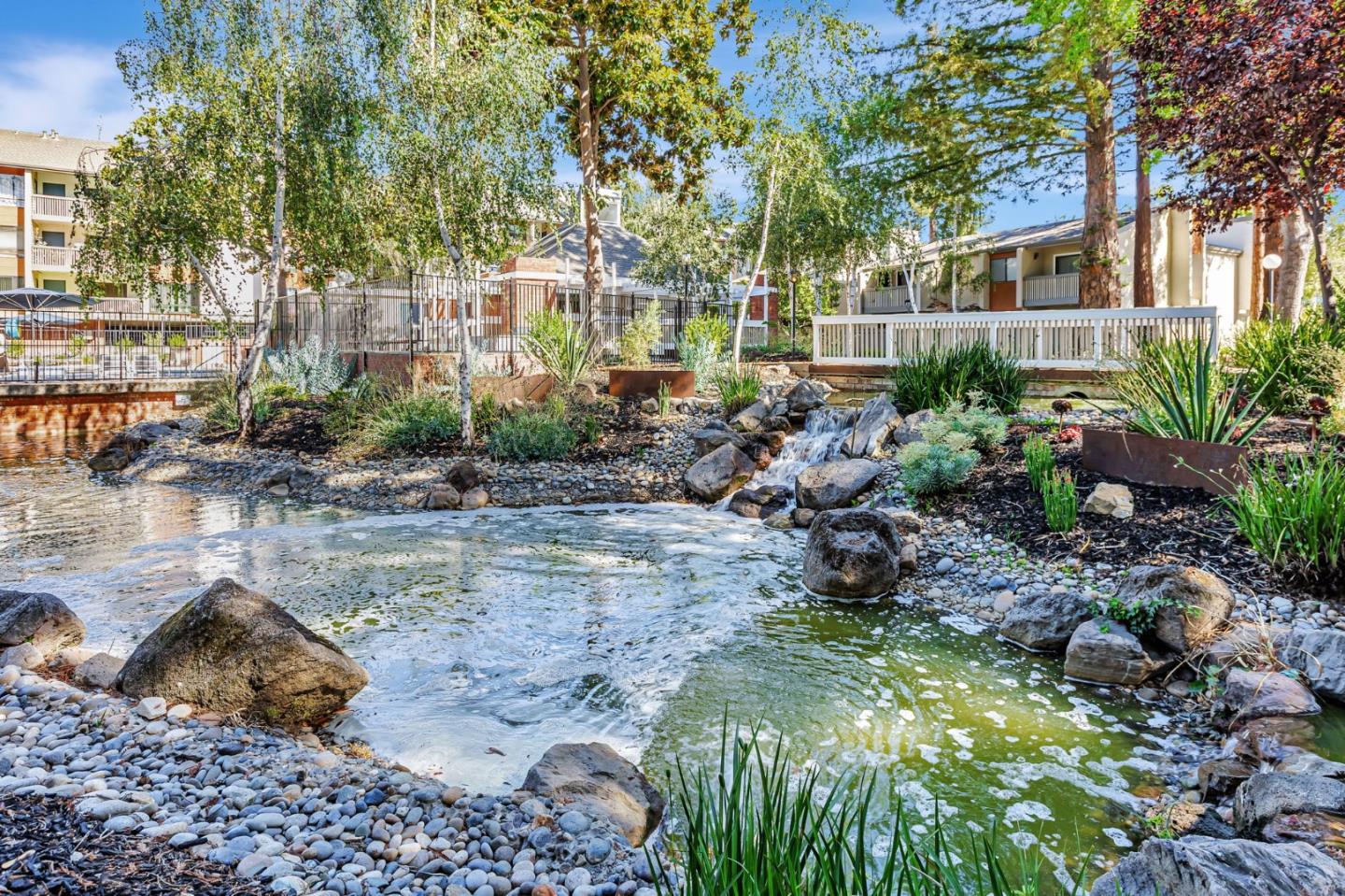 49 Showers Drive, Unit W203 Mountain View, CA 94040 - Photo 34 of 38 a backyard of a house with lots of green space