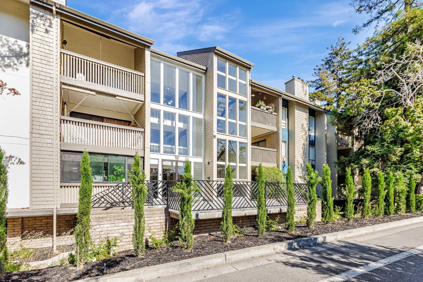 49 Showers Drive, Unit W203 Mountain View, CA 94040 - Photo 38 of 38 a front view of a building with a garden