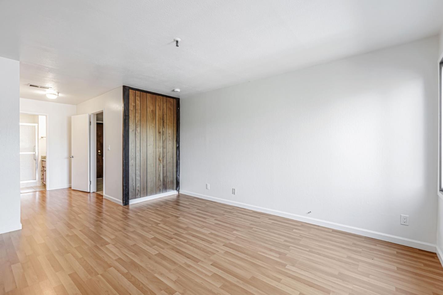49 Showers Drive, Unit W203 Mountain View, CA 94040 - Photo 8 of 38 a view of an empty room with wooden floor
