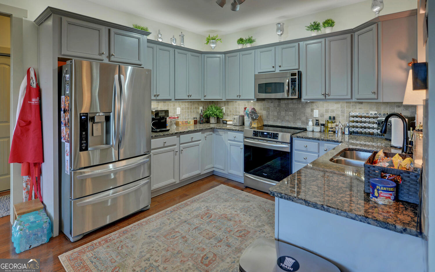 819 Tranquility Lane Hartwell, GA 30643 - Photo 11 of 81 a kitchen with granite countertop a refrigerator and a stove top oven