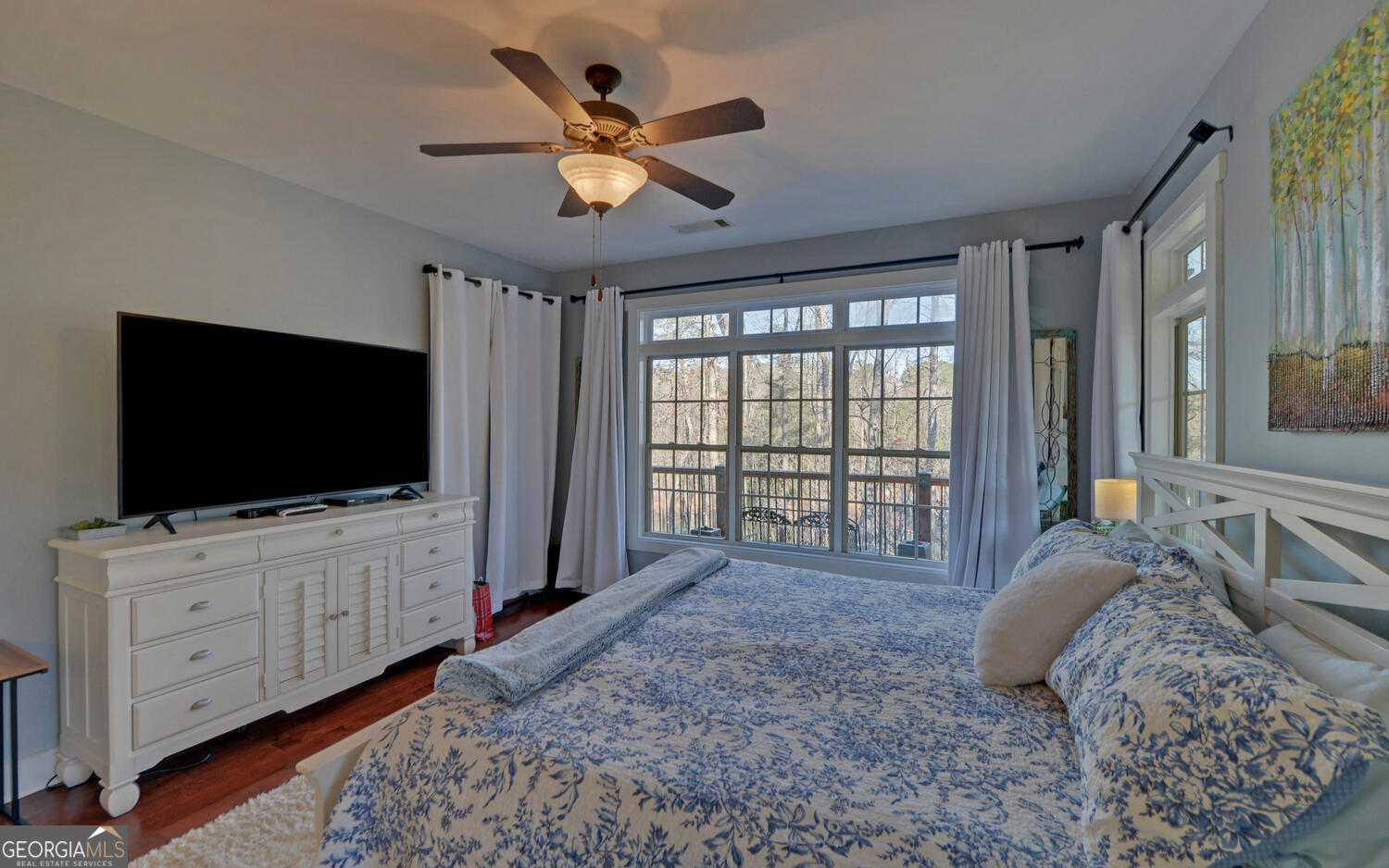 819 Tranquility Lane Hartwell, GA 30643 - Photo 14 of 81 a bed room with a bed a television and a large window