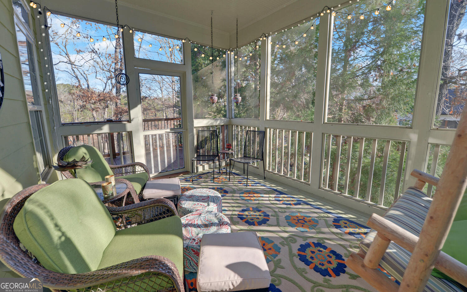 819 Tranquility Lane Hartwell, GA 30643 - Photo 30 of 81 a view of a balcony with chairs and floor to ceiling window