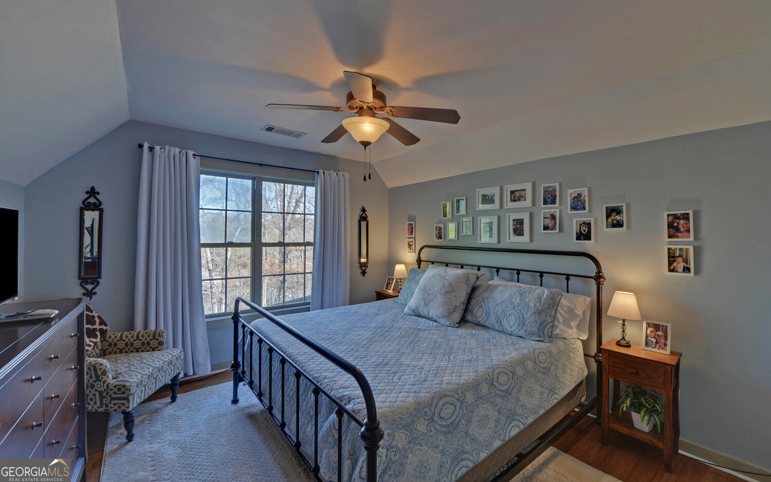 819 Tranquility Lane Hartwell, GA 30643 - Photo 31 of 81 a bedroom with a bed and a chandelier